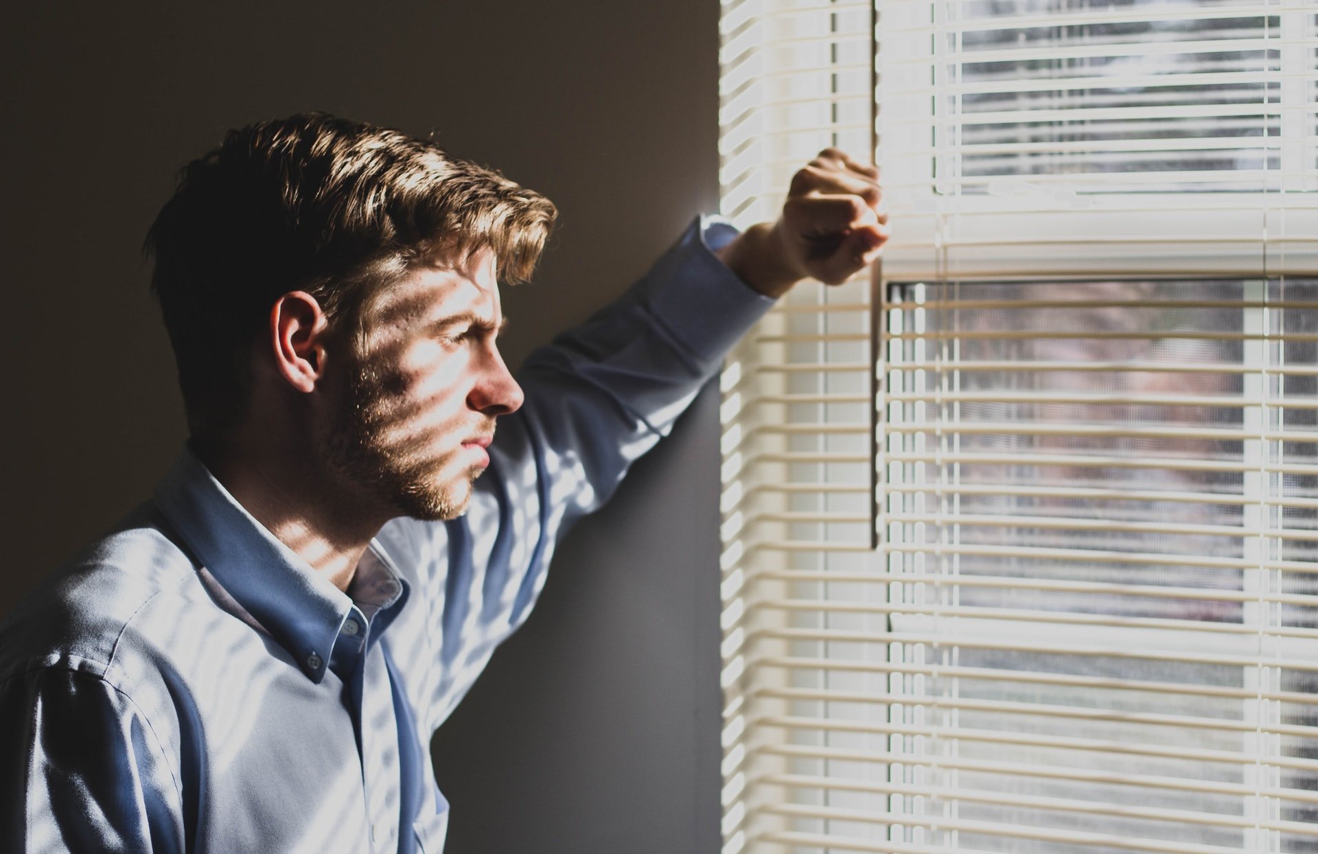 A man looking out a window | Source: Unsplash